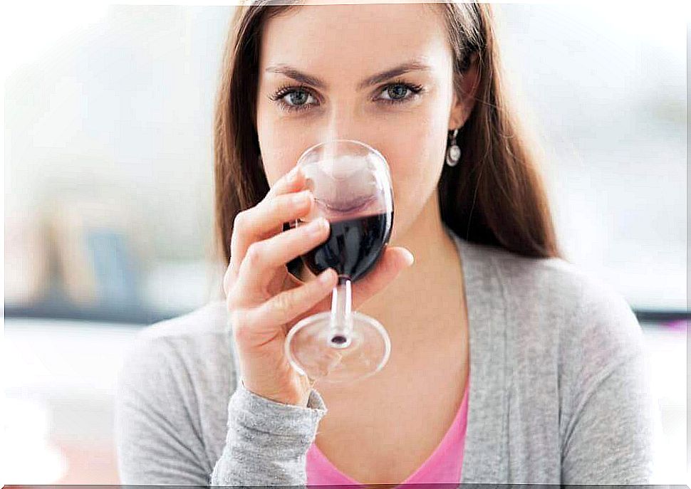 Woman drinking a glass of wine