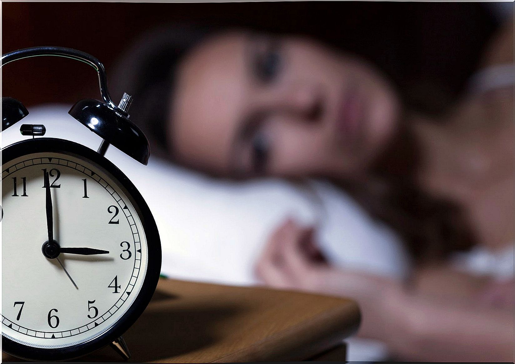 Woman in bed knows that diabetes can lead to insomnia