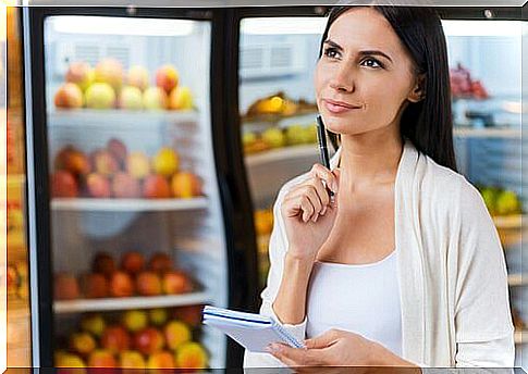 Woman shopping always looks at grocery label